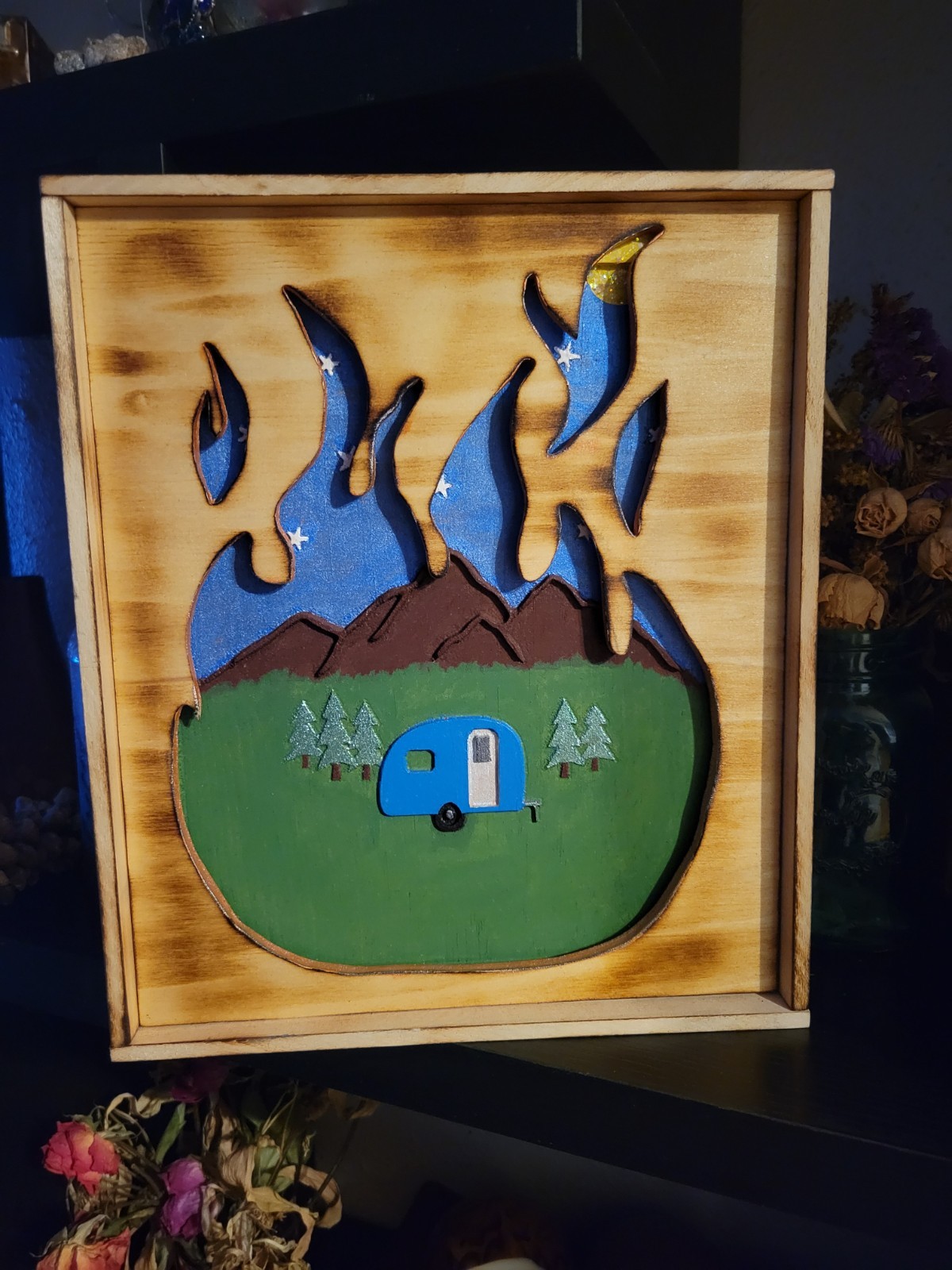 Carved flame, wood sign, camping, mountains